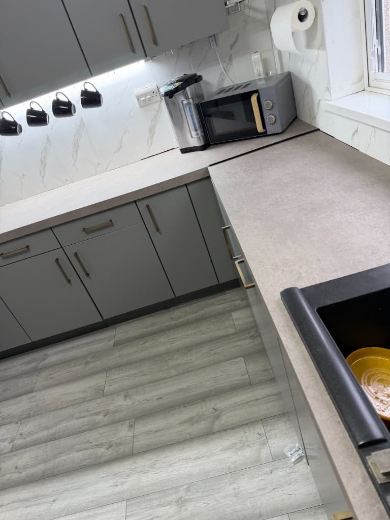 Rotherham kitchen wrap project, grey base unit side angle
