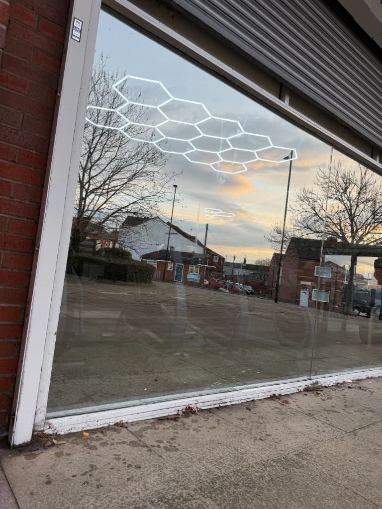 Mirror window film Rotherham — reflective storefront with street reflection