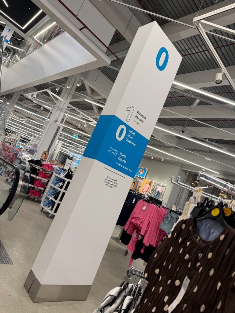 Primark Manchester totem pole vinyl wrap — floor directions