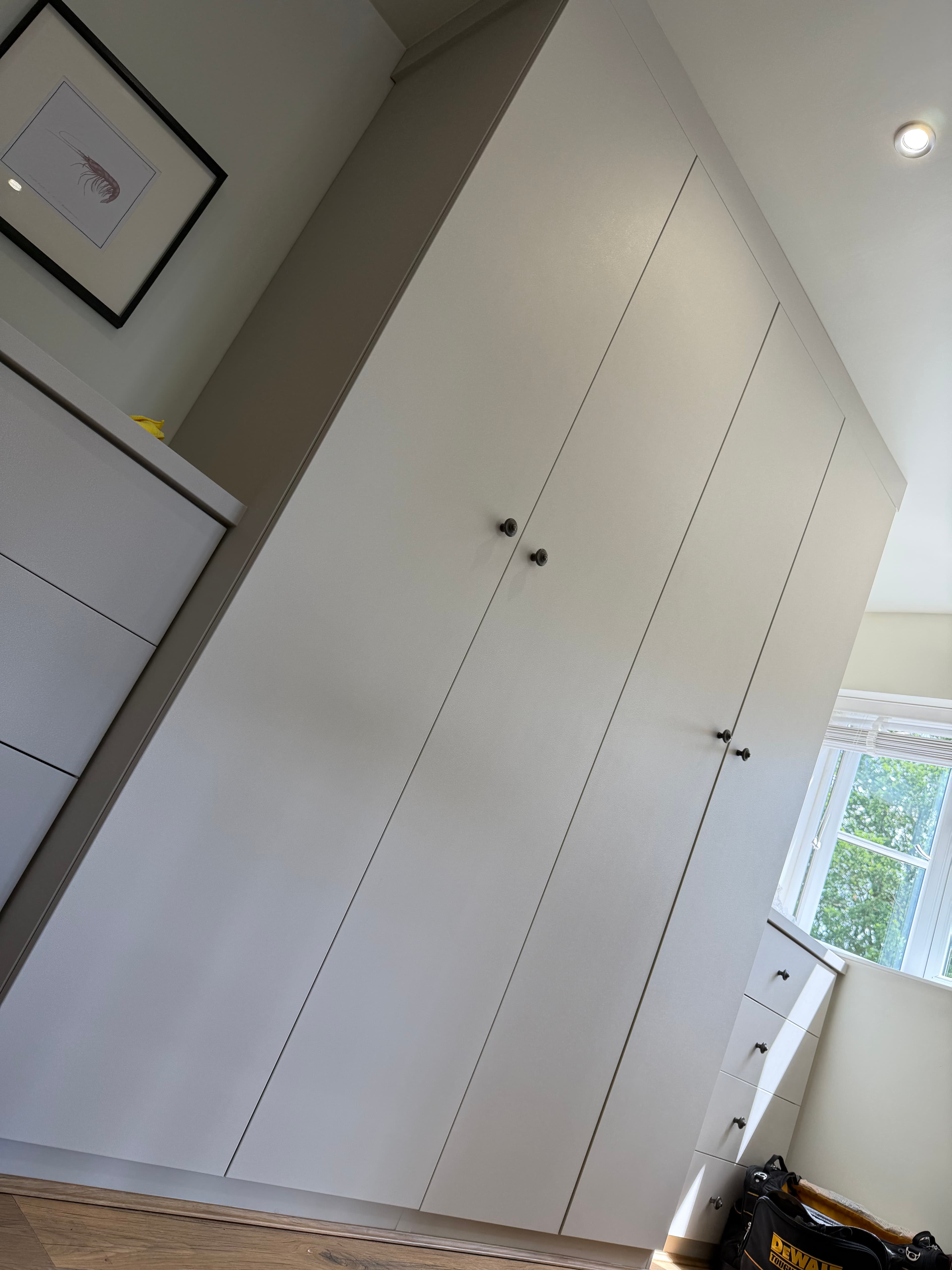Built-in wardrobe Chesterfield — white floor-to-ceiling fitted wardrobe after