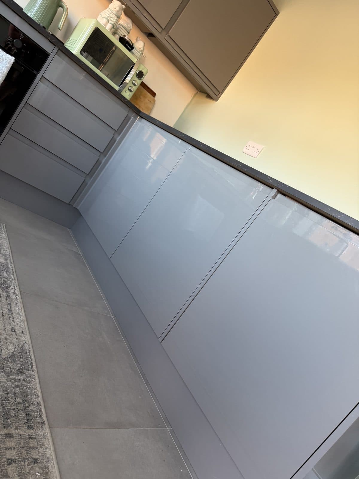 Kitchen wrap Doncaster before — grey base cabinets and dark worktop