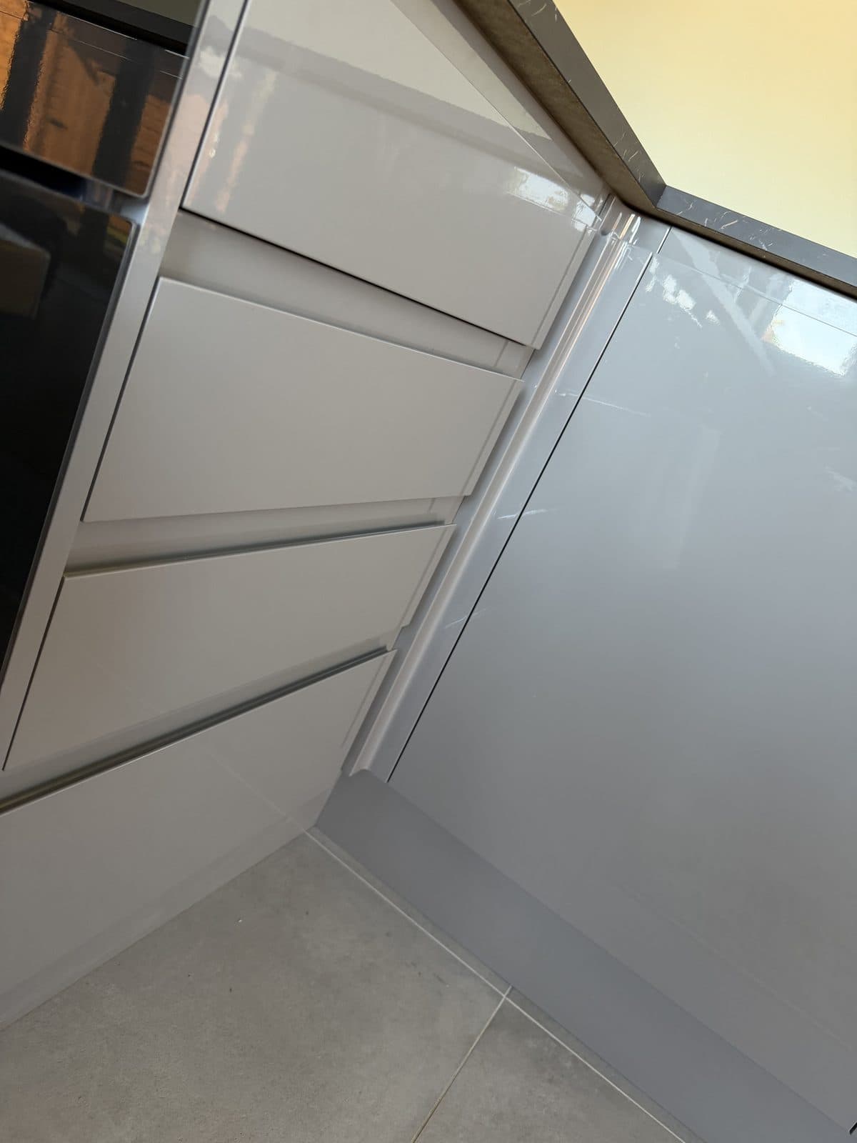 Kitchen wrap Doncaster before — grey drawer fronts and dark marble worktop
