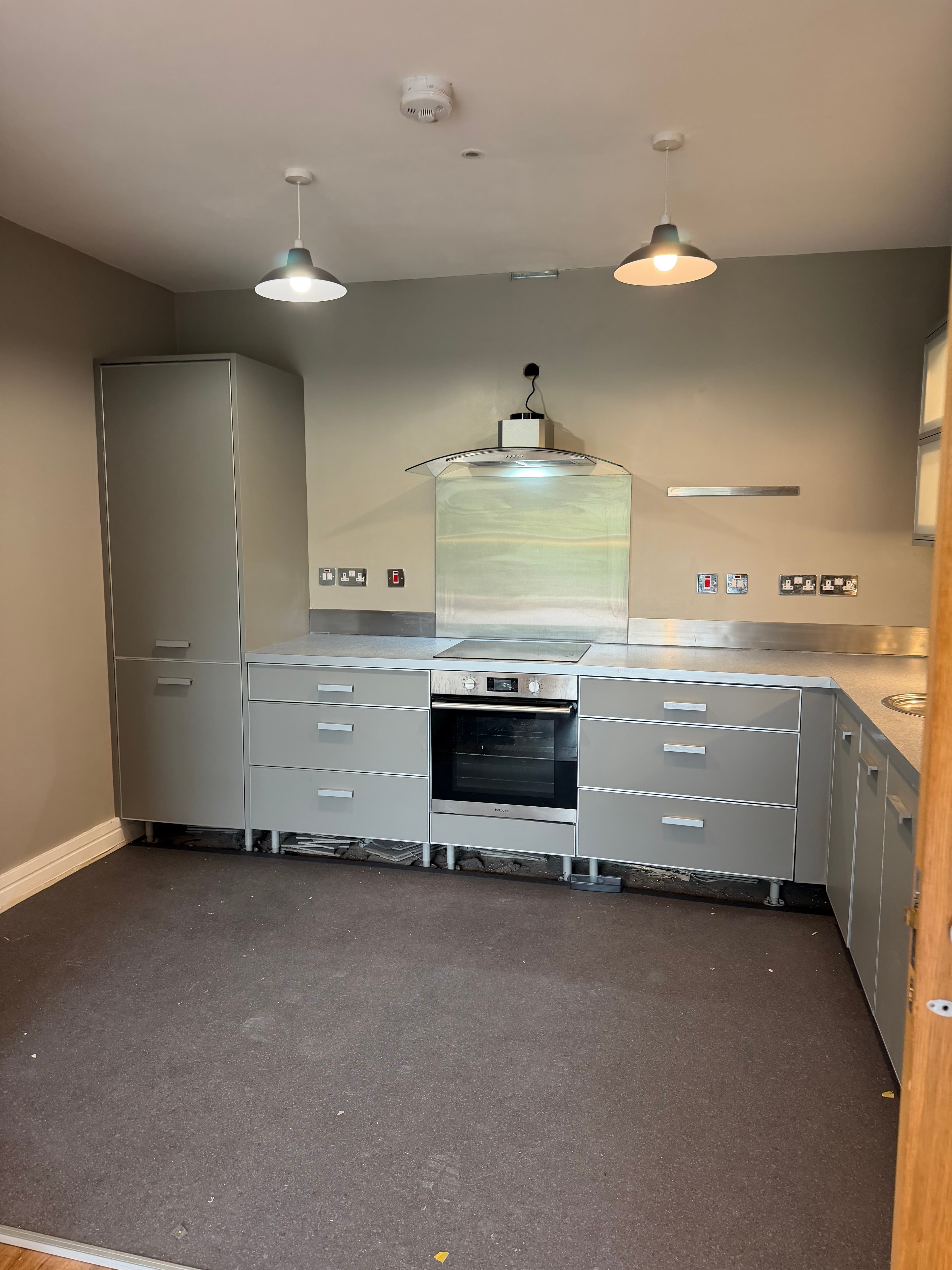 Kitchen wrap Titanic Spa Huddersfield — grey kitchen cabinets during fit