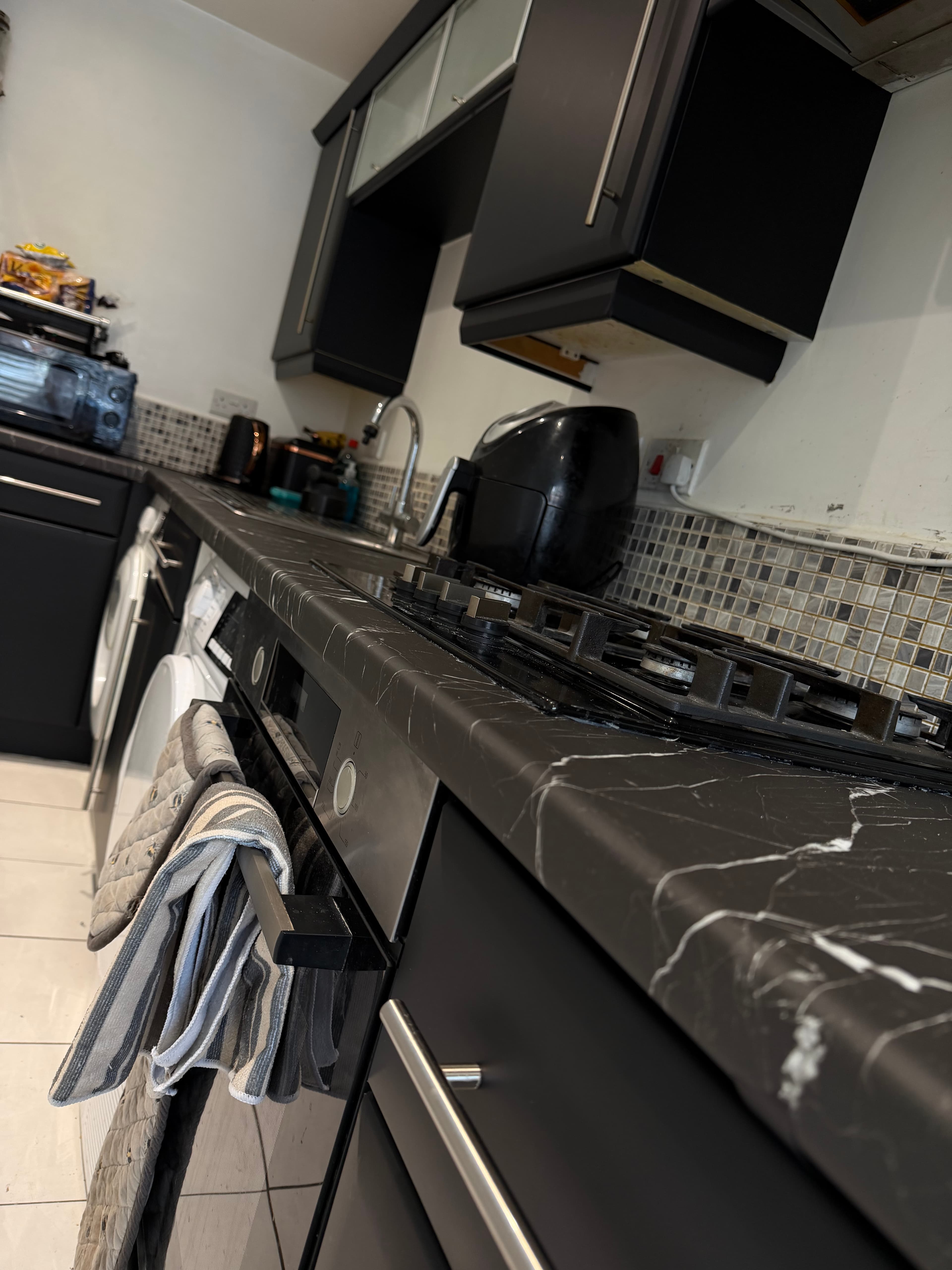 Black kitchen wrap Sheffield — wide kitchen view after