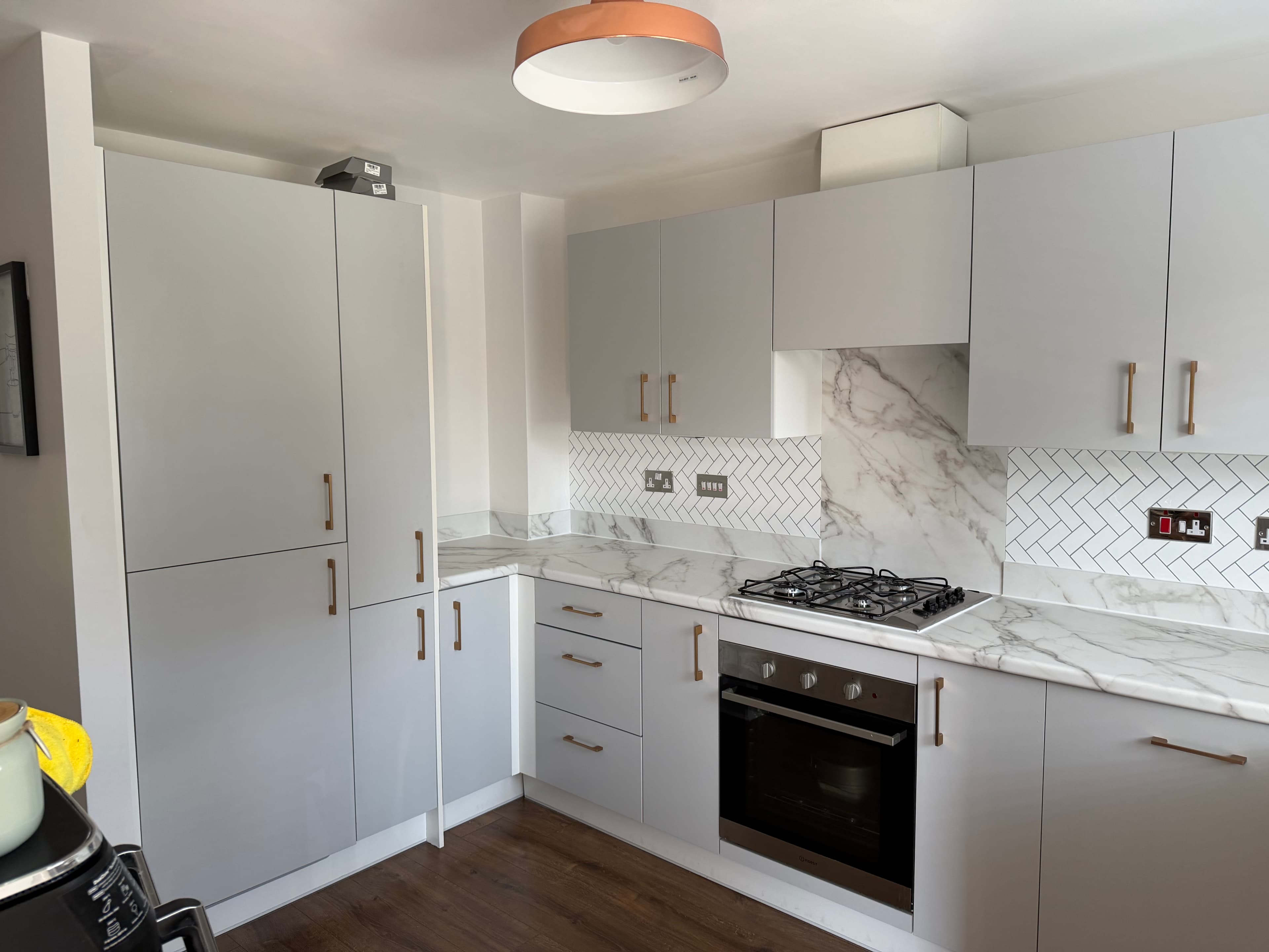 Marble worktop wrap Pontefract — full kitchen with marble-effect worktop after