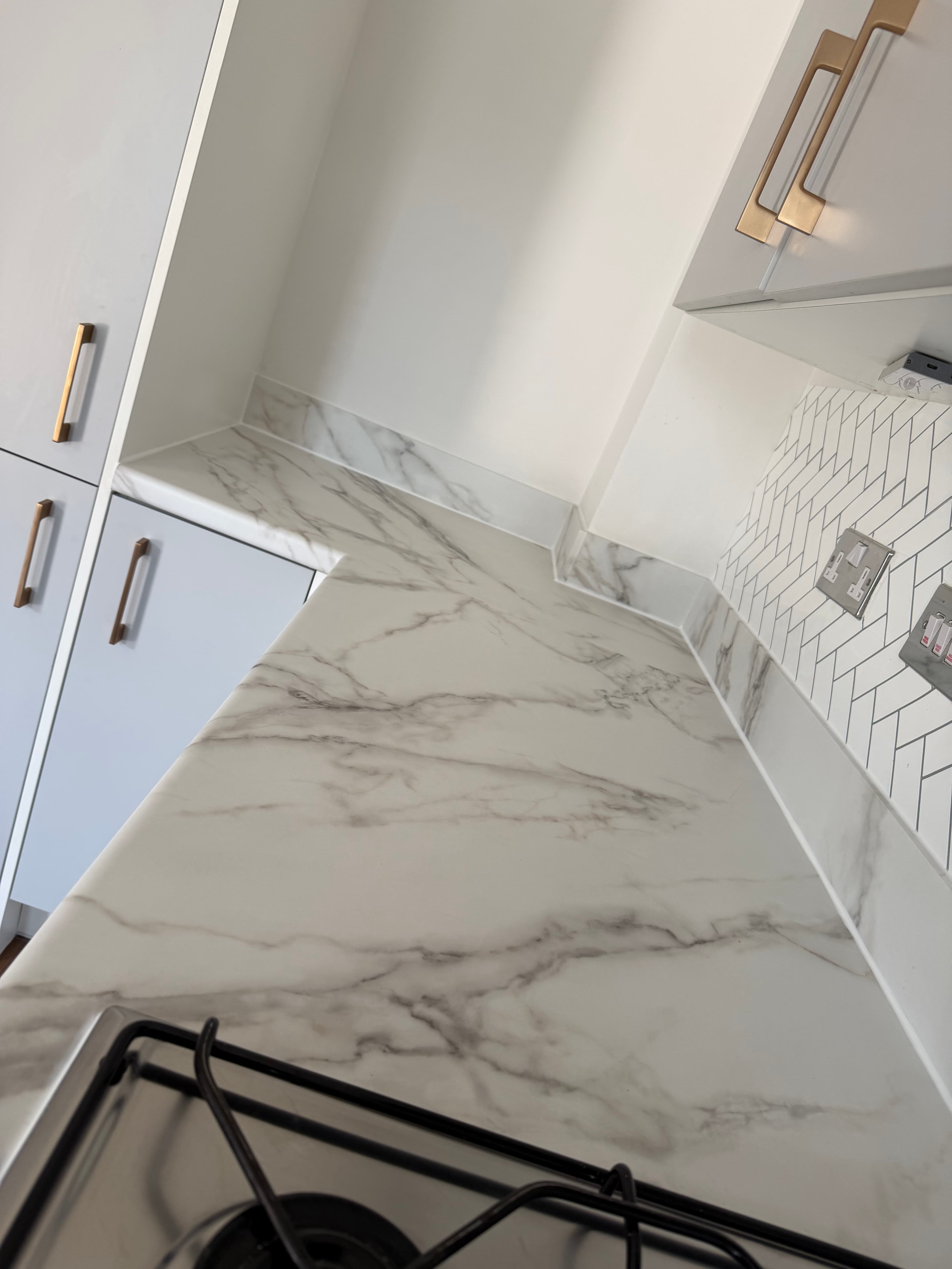 Marble worktop wrap Pontefract — worktop and herringbone tile detail after