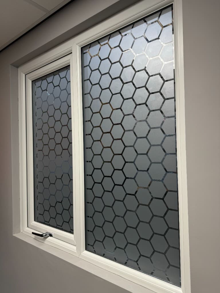 Seasonal promotional wall graphics with large typography and imagery.