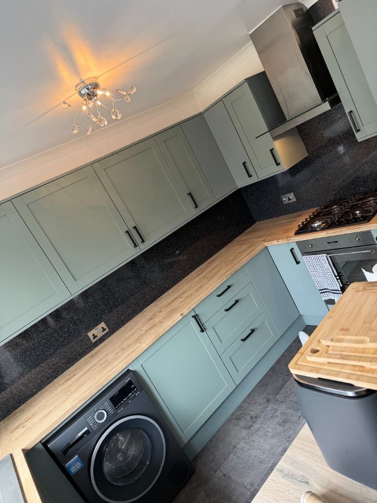 Barnsley kitchen wrapping project with butcher block style worktop and sage units