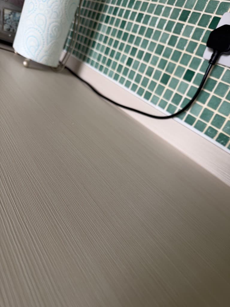 White wood-effect wrapped kitchen worktop Chesterfield — close-up texture detail